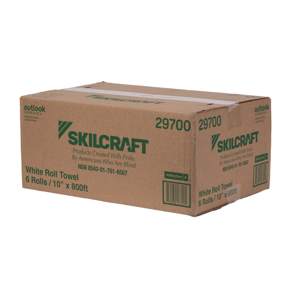 Cardboard box containing Skilcraft white roll towels, labeled with product details, dimensions, and branding from Outlook Nebraska, emphasizing eco-friendly and socially responsible manufacturing.