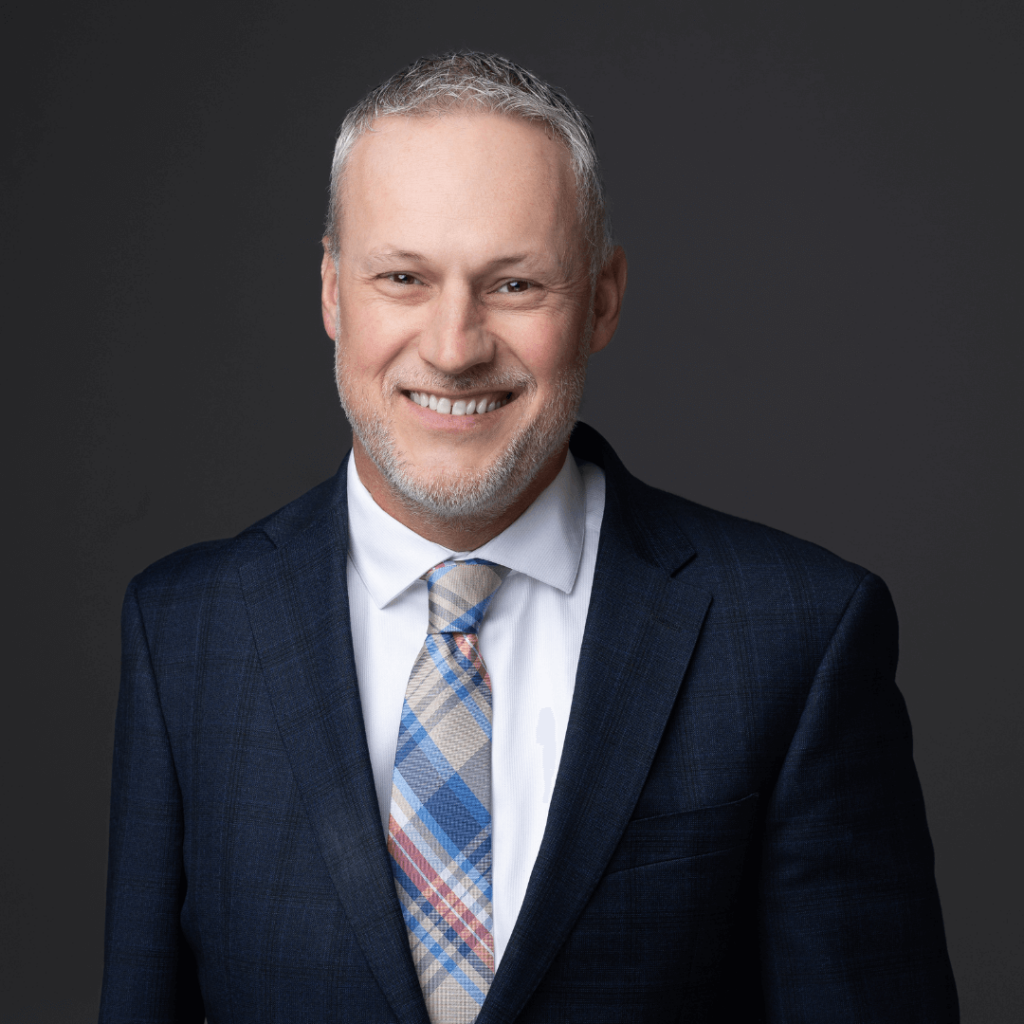 Smiling headshot of President and CEO, Eric Stueckrath