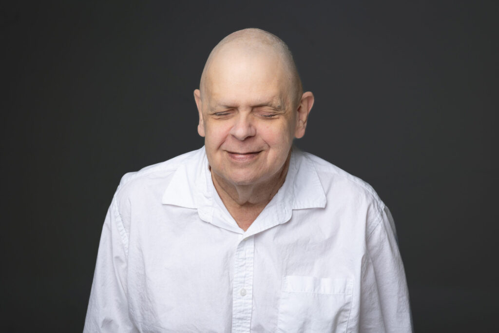 Smiling headshot of Adaptive Tech Trainer, Dennis Nelson