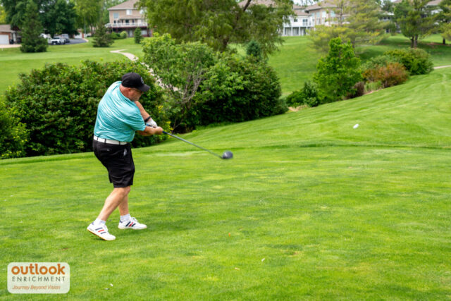 A man swinging his club.