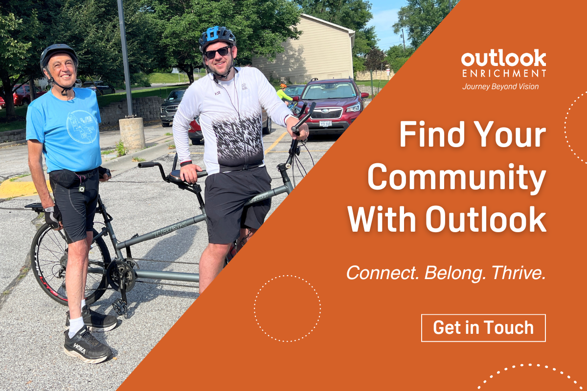 Two adult men smiling on a tandem bike. "Find Your Community With Outlook - Connect. Belong. Thrive. Get in Touch."