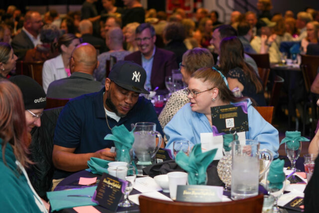 Associates Marquez and Michelle are talking at their table.