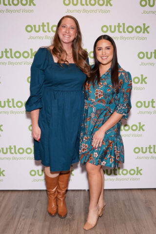 Jenny and Jennie smiling in front of an Outlook backdrop.