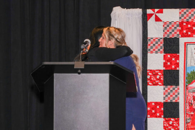 Nina hugging Annie, Volunteer of the Year.